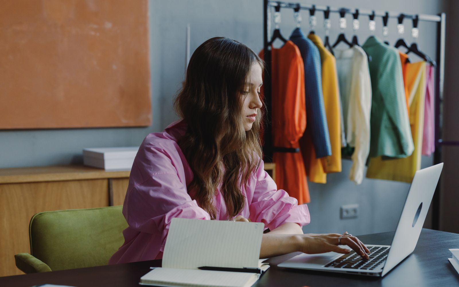 Marketing professional working at a laptop